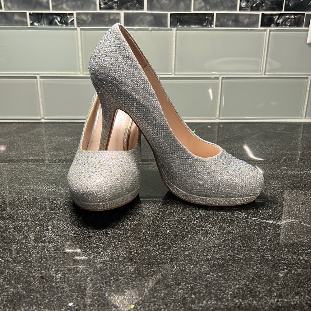 Woman’s silver heels